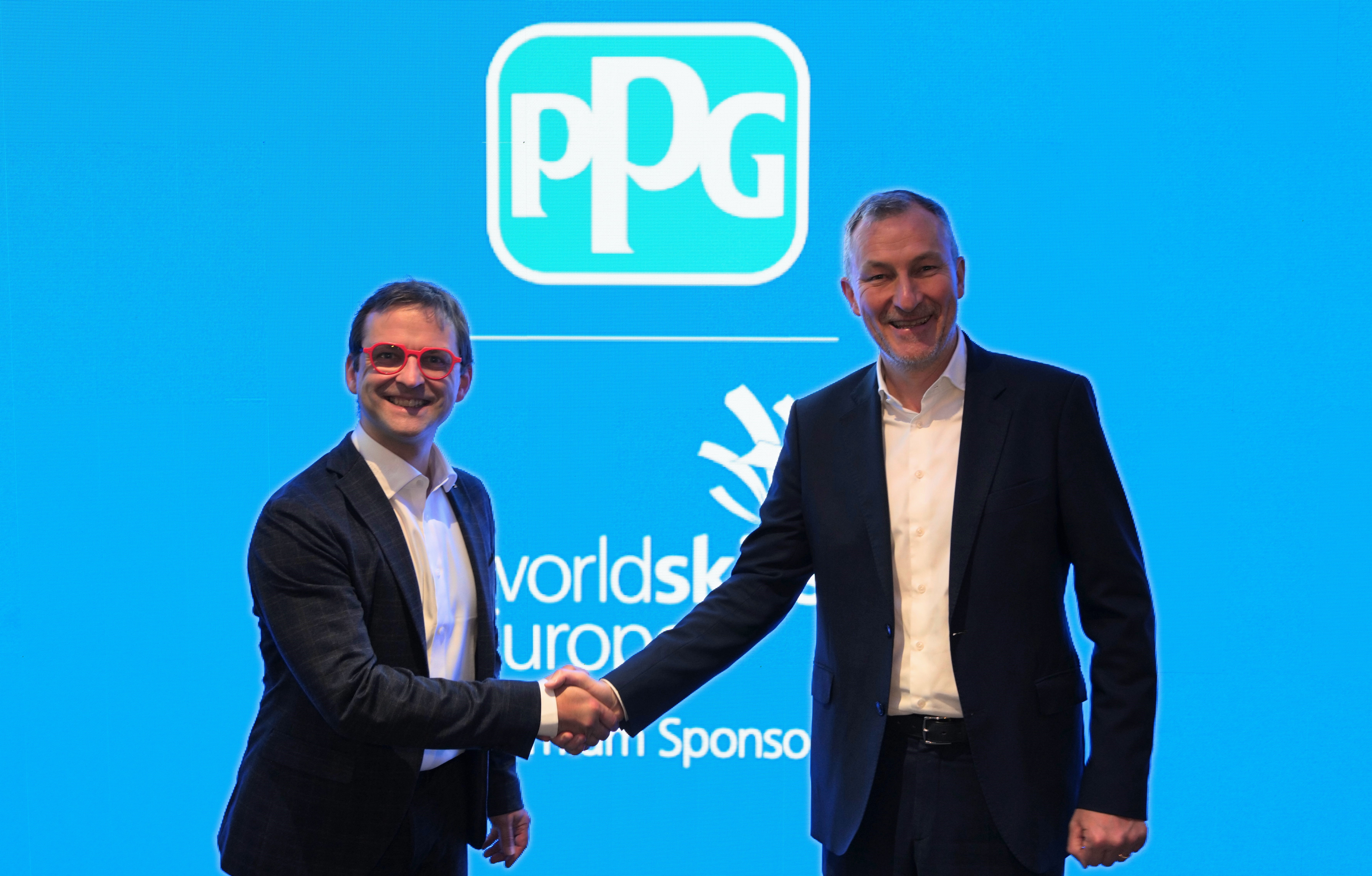 Guillaume Suteau, board chair of WorldSkills Europe (WSE) and Pascal Tisseyre, PPG v.p. government affairs, EMEA celebrate PPG's sponsorship of WSE.